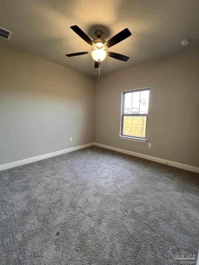 6607 Rocky Shores Rd, Milton, FL 32583 - unfurnished room featuring a textured ceiling, ceiling fan, and dark carpet
