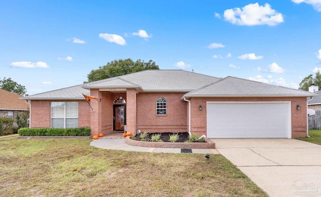 single story home with a front yard and a garage