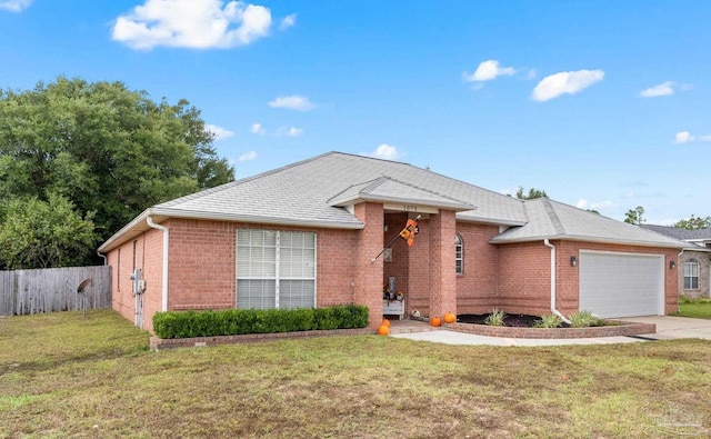 single story home featuring a garage and a front yard