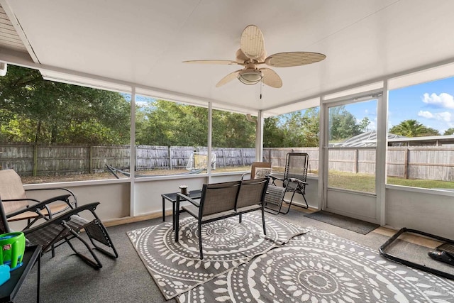 sunroom / solarium with a wealth of natural light and ceiling fan