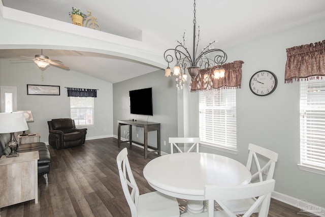 dining area featuring lofted ceiling, ceiling fan with notable chandelier, dark wood-type flooring, and plenty of natural light