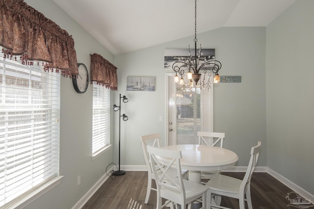 dining room featuring vaulted ceiling, a notable chandelier, and dark hardwood / wood-style flooring