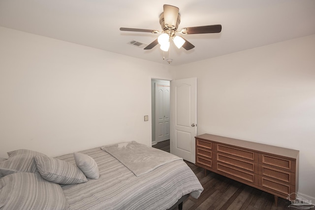 bedroom featuring dark hardwood / wood-style floors and ceiling fan