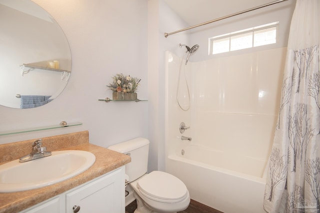 full bathroom with vanity, shower / bath combo, and toilet