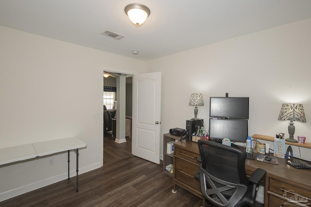 home office with dark wood-type flooring