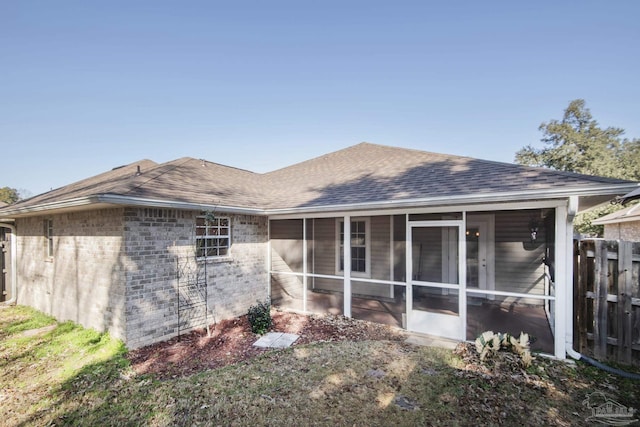 back of house featuring a sunroom