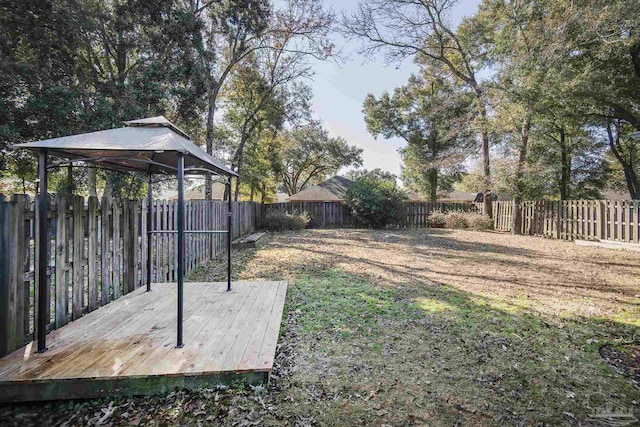 view of yard featuring a gazebo and a deck