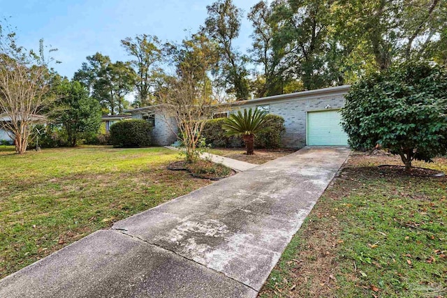 ranch-style house with a front lawn and a garage