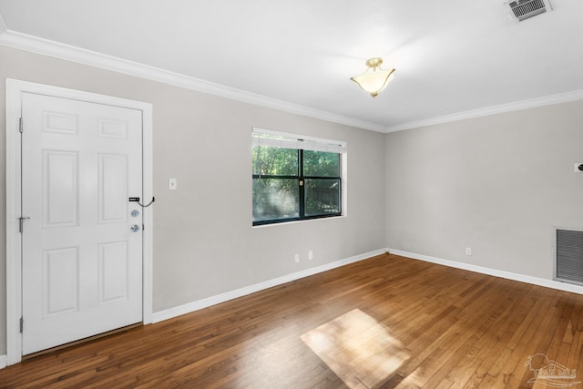 interior space featuring wood-type flooring and crown molding