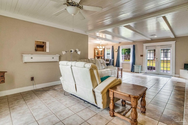 tiled living room with beam ceiling, french doors, wood ceiling, and ceiling fan with notable chandelier