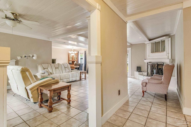 tiled living room featuring beamed ceiling, ceiling fan with notable chandelier, and wooden ceiling