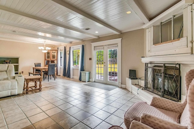 living room featuring a notable chandelier, beam ceiling, light tile patterned floors, and french doors