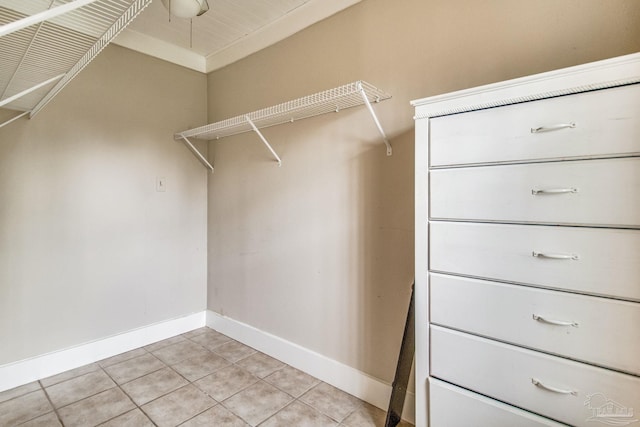 spacious closet with light tile patterned flooring