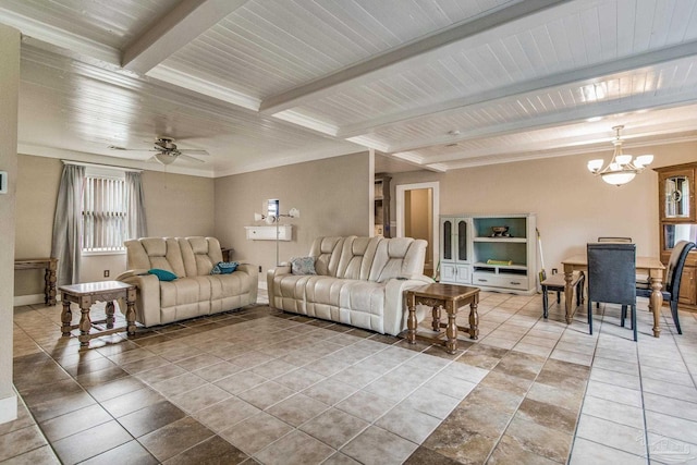 tiled living room featuring beam ceiling and ceiling fan with notable chandelier