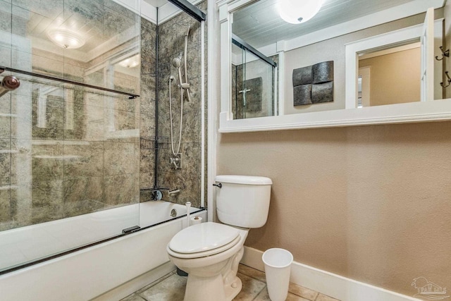 bathroom with tile patterned flooring, enclosed tub / shower combo, and toilet