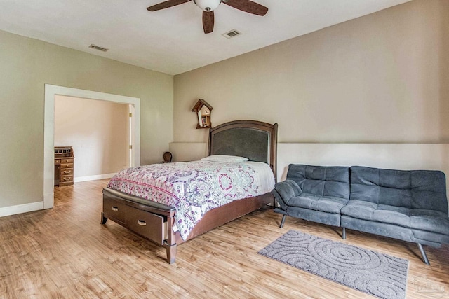 bedroom with ceiling fan and light hardwood / wood-style floors