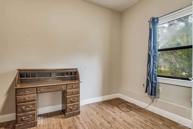 unfurnished office featuring light hardwood / wood-style flooring