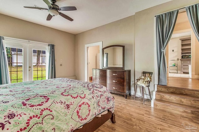 bedroom with ceiling fan, access to exterior, and light hardwood / wood-style flooring