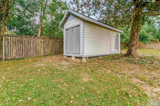 view of outdoor structure with a lawn