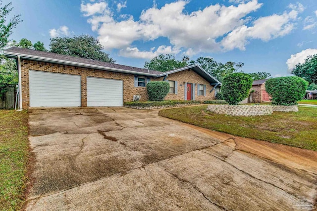 ranch-style house featuring a garage