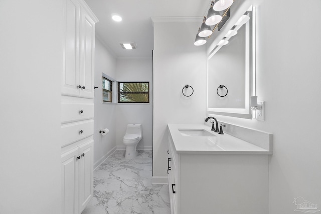 bathroom featuring vanity, toilet, baseboards, and marble finish floor