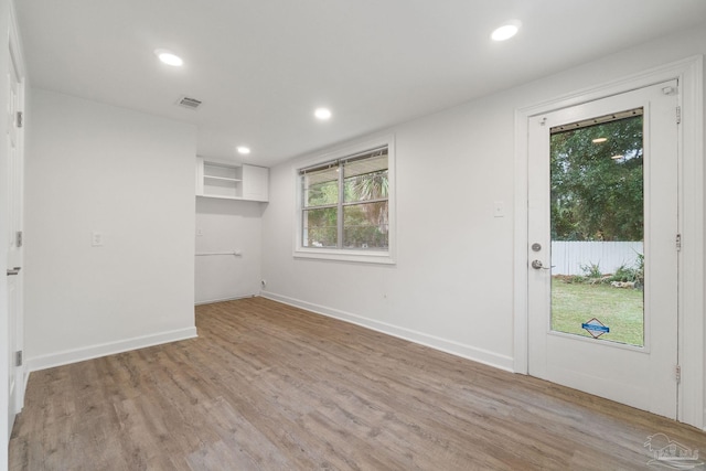 spare room with light wood-type flooring