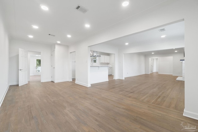 unfurnished living room with light wood-type flooring