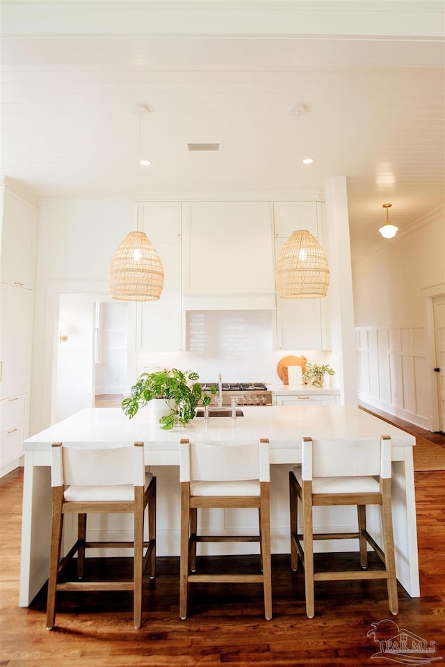 details featuring white cabinets and high end stainless steel range