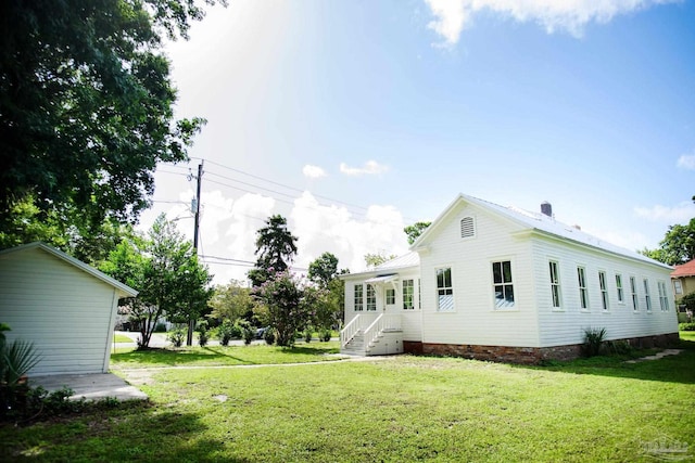 exterior space featuring a lawn