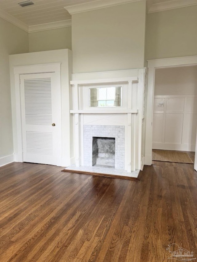 1524 E Strong St, Pensacola, FL 32501 - unfurnished living room featuring ornamental molding, wood finished floors, and a tile fireplace