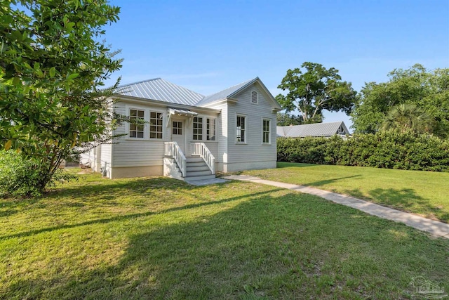 1524 E Strong St, Pensacola, FL 32501 - view of front of home featuring a front lawn and metal roof