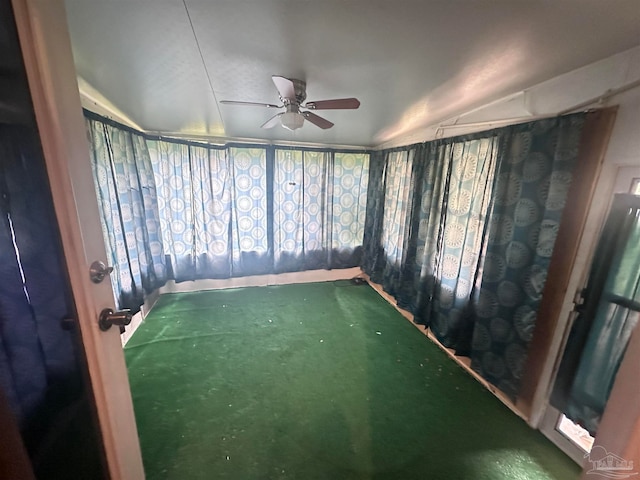 unfurnished sunroom featuring ceiling fan