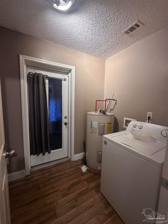 laundry room with visible vents, wood finished floors, water heater, washer / dryer, and laundry area