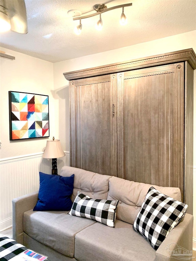 living room featuring a textured ceiling