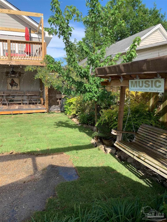 view of yard featuring a wooden deck