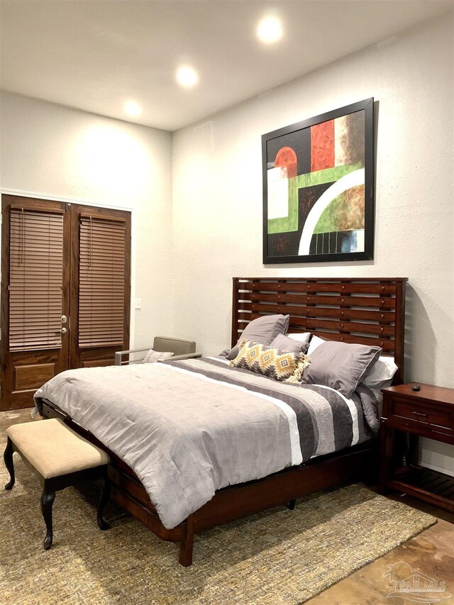 bedroom with hardwood / wood-style flooring