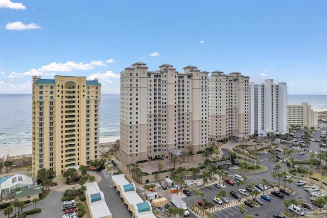 view of property featuring a beach view and a water view