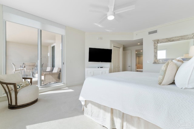 carpeted bedroom with connected bathroom, ceiling fan, and crown molding