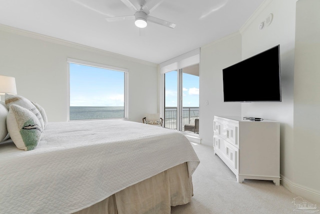 carpeted bedroom with ceiling fan, access to exterior, and ornamental molding