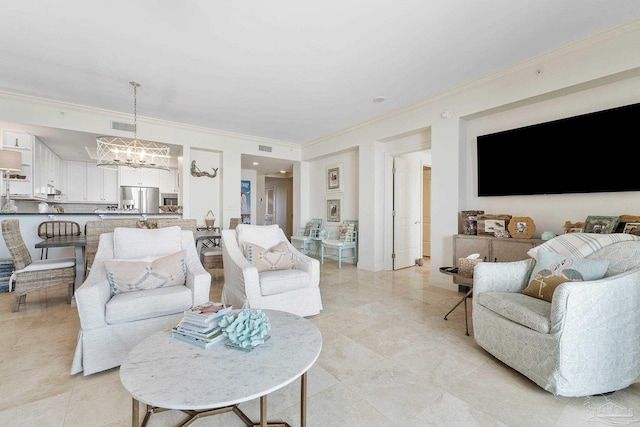 living room featuring a chandelier and ornamental molding