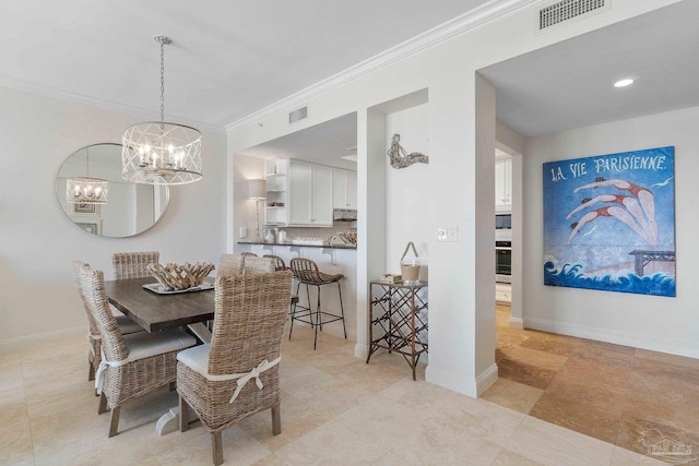 dining area featuring light tile patterned flooring, ornamental molding, and a chandelier