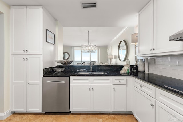 kitchen featuring dishwasher, sink, decorative backsplash, dark stone countertops, and white cabinetry