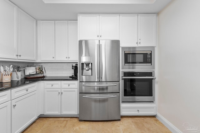 kitchen with backsplash, white cabinetry, light tile patterned flooring, and stainless steel appliances