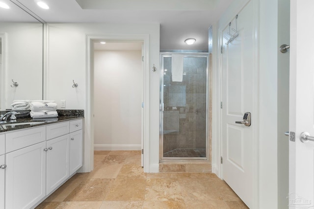 bathroom with vanity and walk in shower