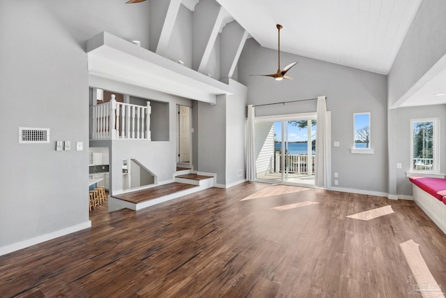 unfurnished living room featuring ceiling fan, high vaulted ceiling, and dark wood-type flooring