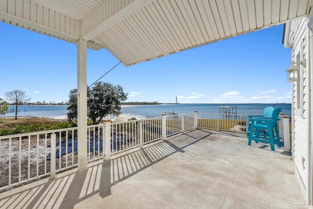 view of patio with a water view