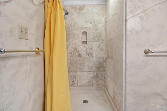 bathroom featuring a shower with curtain