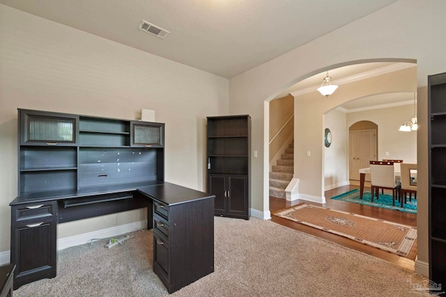 home office featuring light carpet, crown molding, and a chandelier