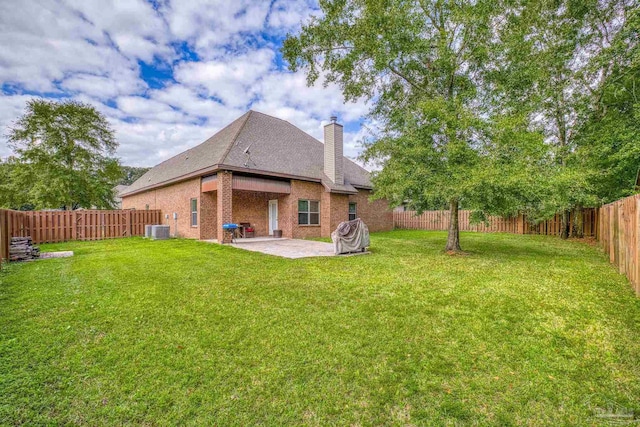 view of yard with a patio and central AC