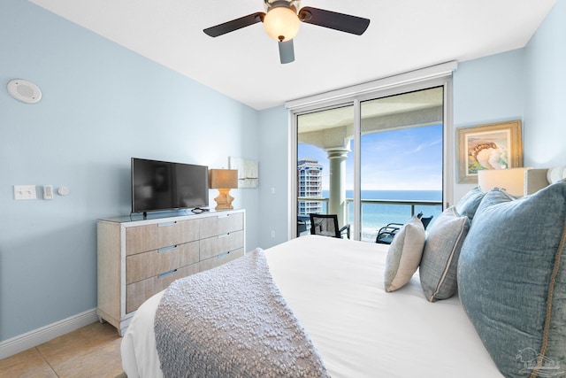 bedroom with light tile patterned floors, a ceiling fan, baseboards, floor to ceiling windows, and access to outside